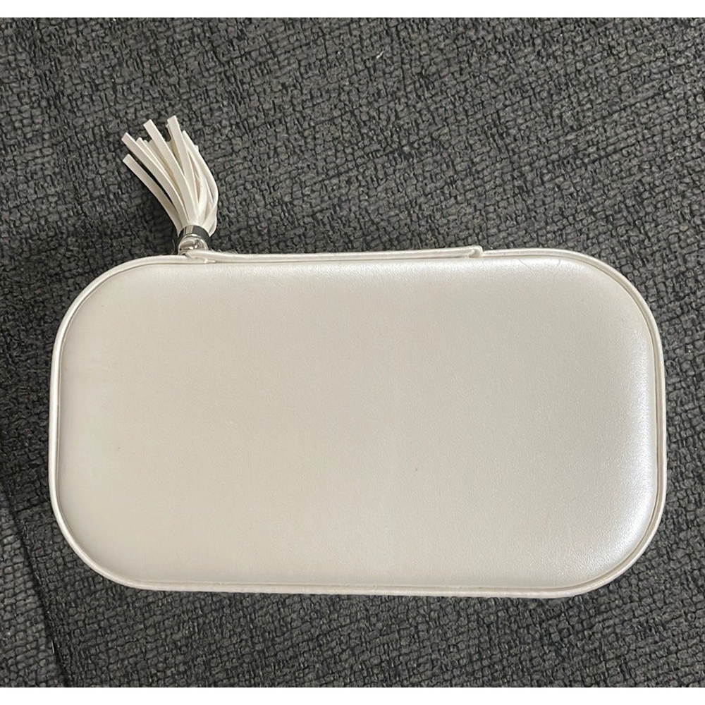 White faux-leather zip around travel jewelry case